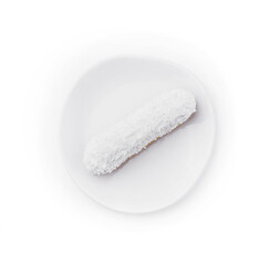 eclair in white glaze and coconut flakes