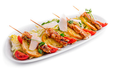 trendy Caesar salad with chicken on wooden skewers