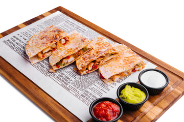 Mexican quesadilla with chicken on wooden board