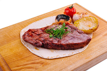 Delicious grilled pork chop on pita bread