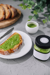 Tasty bruschetta with pesto sauce top view