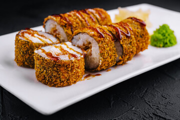 Warm tempura sushi rolls close up