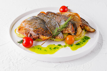 fried fish with vegetables on plate