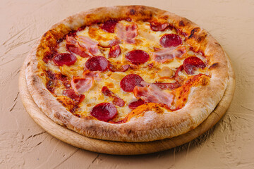 pepperoni pizza with ham on wood
