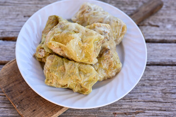 Cabbage rolls with meat, rice and vegetables. Stuffed cabbage leaves with  ground beef. Known as sarma, golubtsy, dolma.
