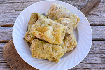 Cabbage rolls with meat, rice and vegetables. Stuffed cabbage leaves with  ground beef. Known as sarma, golubtsy, dolma.