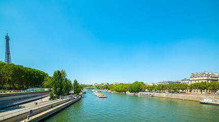 Fototapeta na wymiar Seine river with world famous Eiffel Tower on the background