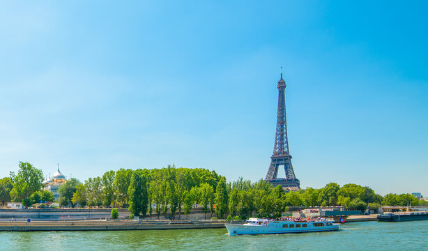 Blue sky over Seine River and world famous Eiffel Tower in Paris