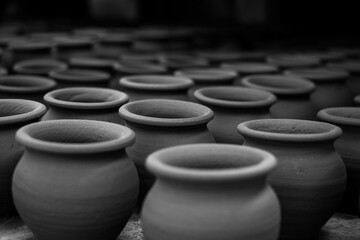 Pottery making involves shaping clay by hand, using a wheel, or coiling techniques.