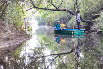 Fototapeta na wymiar Senior couple tourist traveling on boat at lake