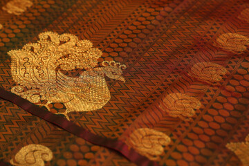 Indian made wedding red silk fabric with oeacock design	
