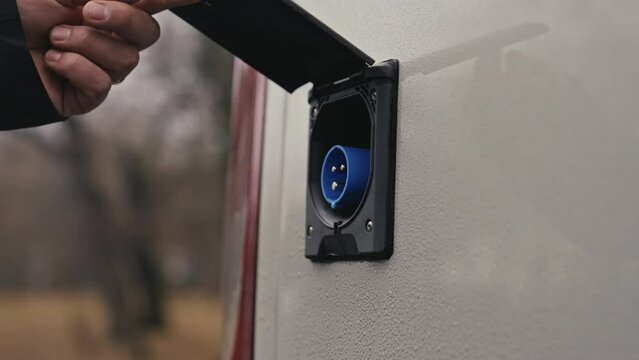 Opening a Camper Van electric power outlet 