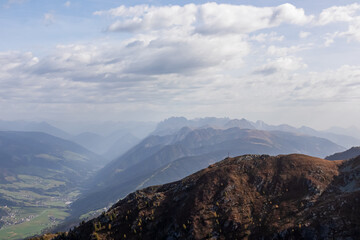 Scenic view from mountain peak Helm (Monte Elmo) in Carnic Alps, South Tyrol, Austria Italy border, Europe. Looking at majestic mountain range of Lienz Dolomites. Hiking on carnic peace trail in Alps