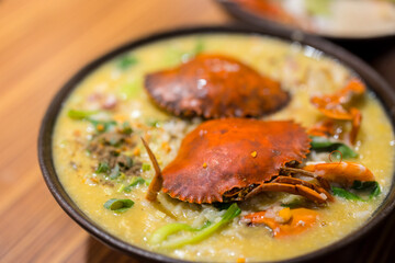 Seafood congee bowl with crab in restaurant