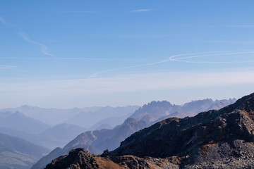 Naklejka premium Scenic view from mountain peak Hornischegg (Monte Arnese), Carnic Alps, South Tyrol, Austria Italy border, Europe. Looking at majestic mountain range Lienz Dolomites. Hiking carnic peace trail in Alps