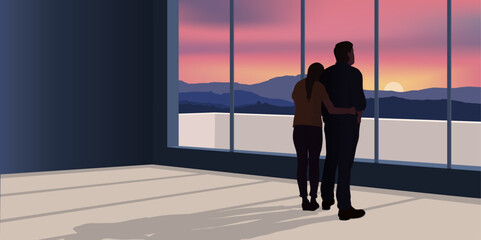 Un couple venant d’investir dans l’immobilier, contemple le paysage de montagne vue de son appartement.
