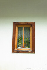 One old window with wooden frame, a fragment of the facade of an old building in Tatra Mountains, Poland. High quality photo