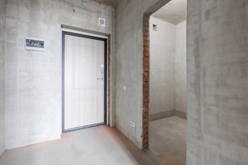 Fototapeta premium interior of the apartment without decoration in gray colors. rough finish