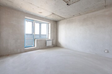 interior of the apartment without decoration in gray colors. rough finish