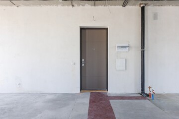 interior of the apartment without decoration in gray colors. rough finish
