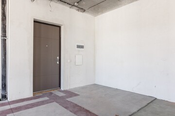 interior of the apartment without decoration in gray colors. rough finish