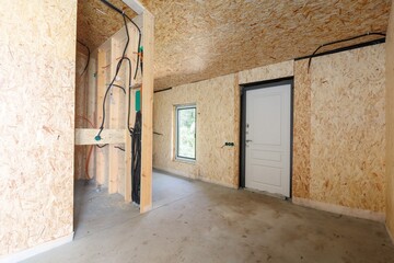 Obraz premium interior of the apartment without decoration in gray colors. rough finish