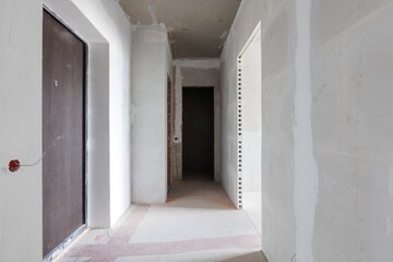 interior of the apartment without decoration in gray colors. rough finish