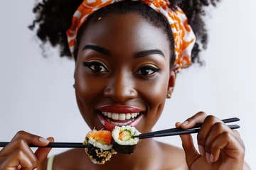 Fotobehang Surprise African Girl Eats Sushi On White Background © Ян Заболотний