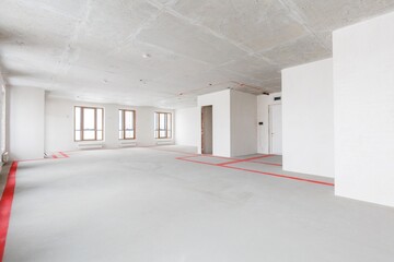 Fototapeta premium interior of the apartment without decoration in gray colors. rough finish