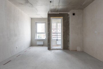 interior of the apartment without decoration in gray colors. rough finish