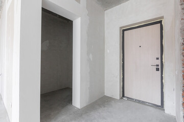 interior of the apartment without decoration in gray colors. rough finish