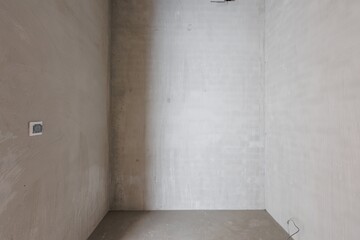 interior of the apartment without decoration in gray colors. rough finish