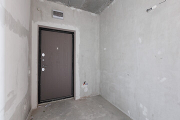 interior of the apartment without decoration in gray colors. rough finish