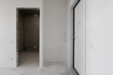interior of the apartment without decoration in gray colors. rough finish