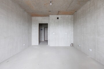 interior of the apartment without decoration in gray colors. rough finish