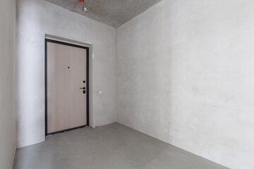 interior of the apartment without decoration in gray colors. rough finish