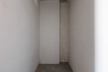 interior of the apartment without decoration in gray colors. rough finish