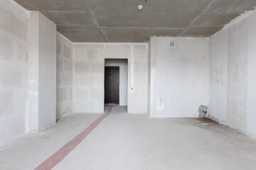 interior of the apartment without decoration in gray colors. rough finish
