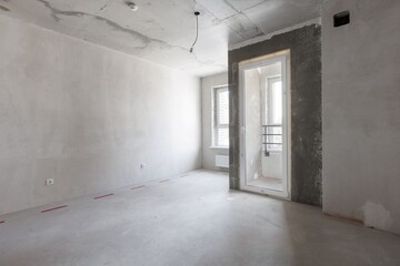 interior of the apartment without decoration in gray colors. rough finish