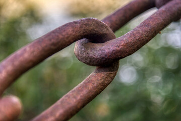 Close up a rusty iron chain or the interlocking steel rings