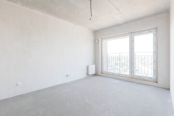 interior of the apartment without decoration in gray colors. rough finish