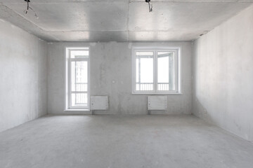 interior of the apartment without decoration in gray colors. rough finish