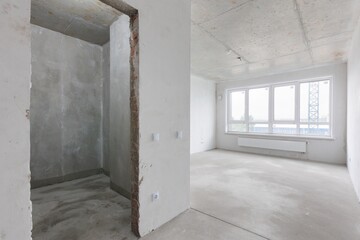 interior of the apartment without decoration in gray colors. rough finish