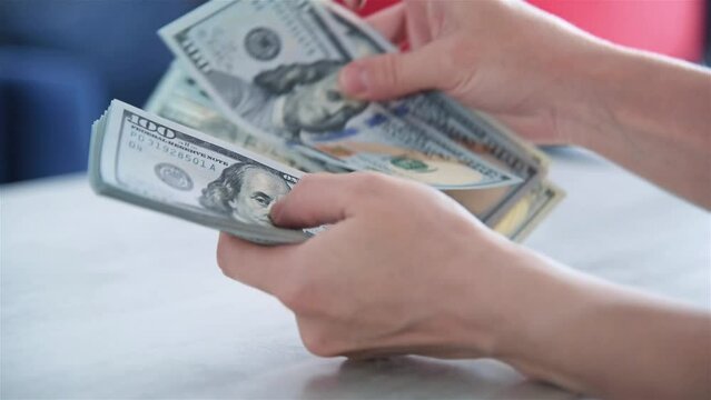 Woman Hands Counting Dollars. Business Profit And Budget Concept. Slow Motion Effect.