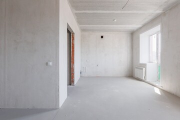 interior of the apartment without decoration in gray colors. rough finish