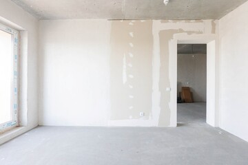 interior of the apartment without decoration in gray colors. rough finish