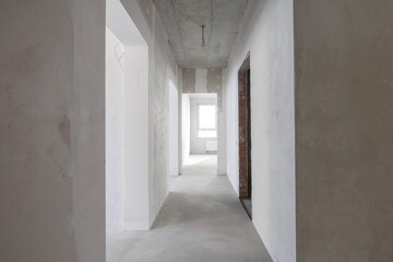 interior of the apartment without decoration in gray colors. rough finish