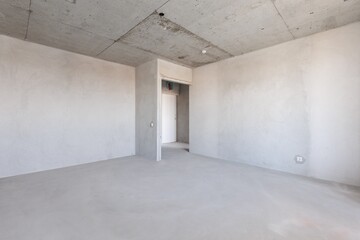 Fototapeta premium interior of the apartment without decoration in gray colors. rough finish