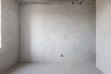 interior of the apartment without decoration in gray colors. rough finish