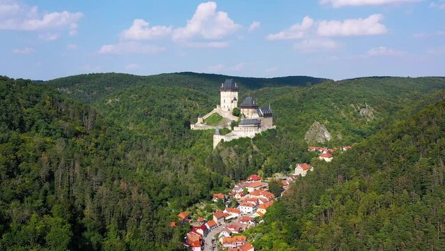 Royal Castle Karlstejn. Central Bohemia, Karlstejn village, Czechia. Aerial view to The Karlstejn castle. Royal palace founded King Charles IV. Amazing gothic monument in Czech Republic, Europe.
